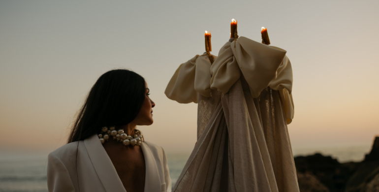 Detail of bespoke wedding table with candles and neutral tones.